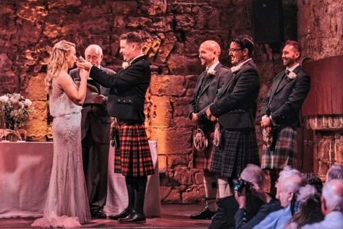 couple drink from wedding quaich
